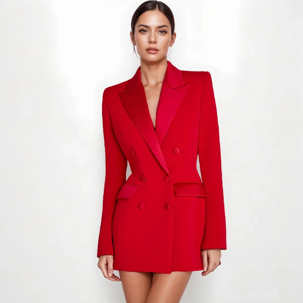 A woman modeling a bright red double-breasted blazer with matching red mini skirt against a plain white studio background. Nadine merabi red blazer dress for elegant parties