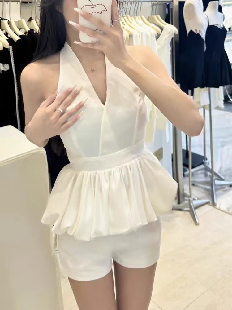 Person wearing a white outfit in a clothing store. top high quality luxury trending popular outfit